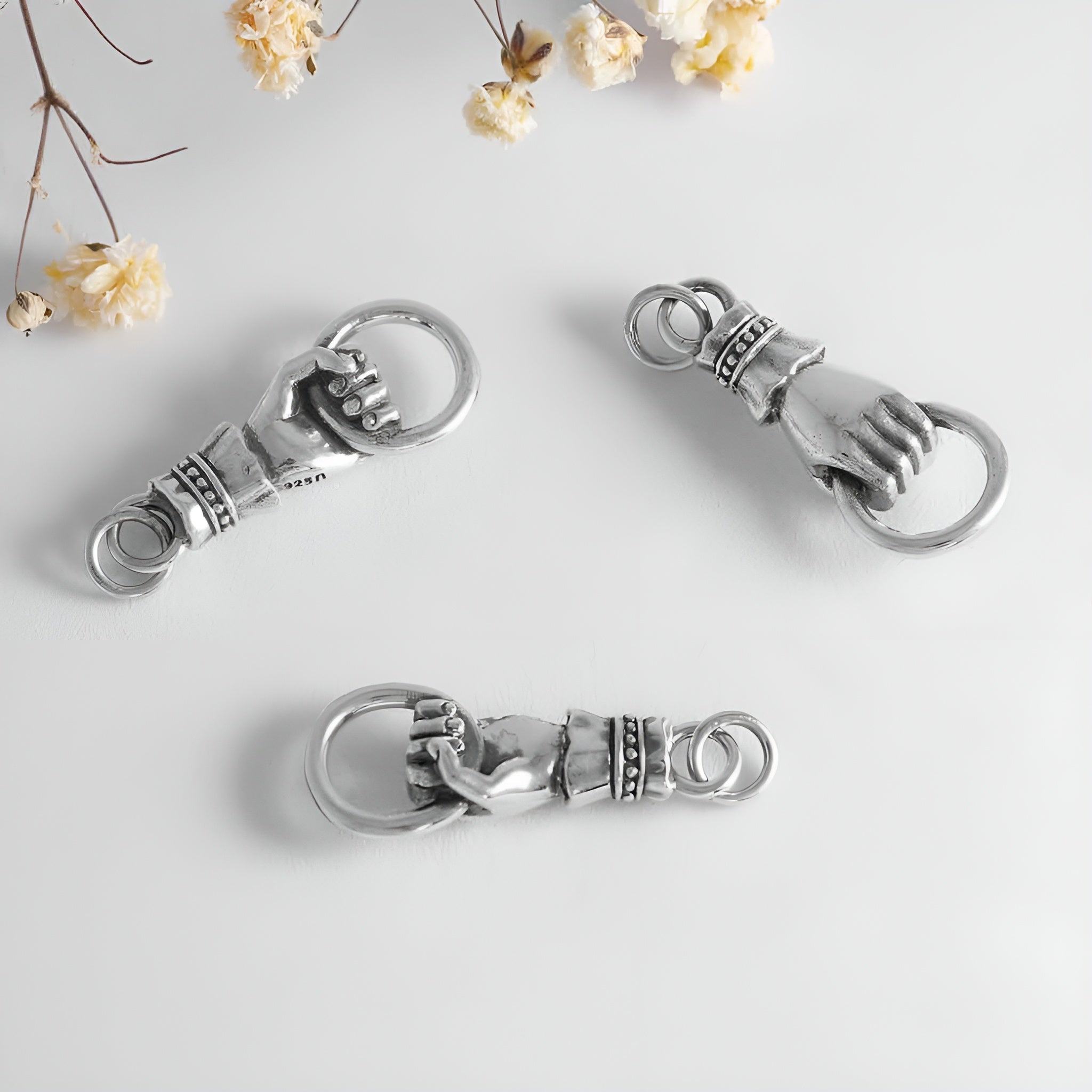 Sterling Silver Hand Link Holding a Ring