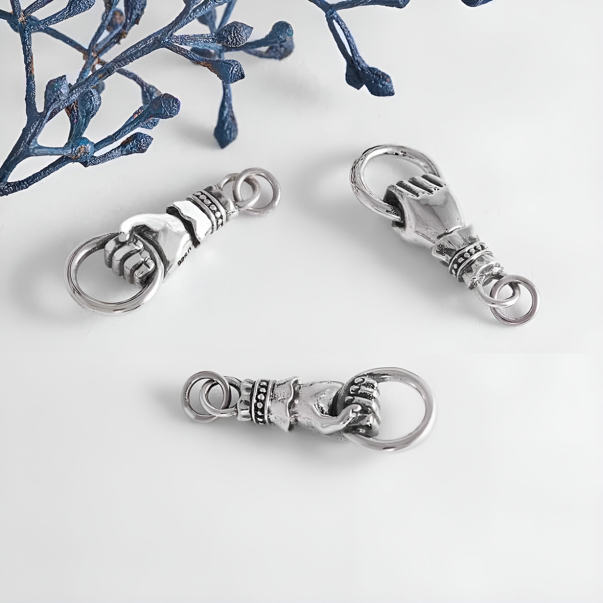 Sterling Silver Hand Link Holding a Ring